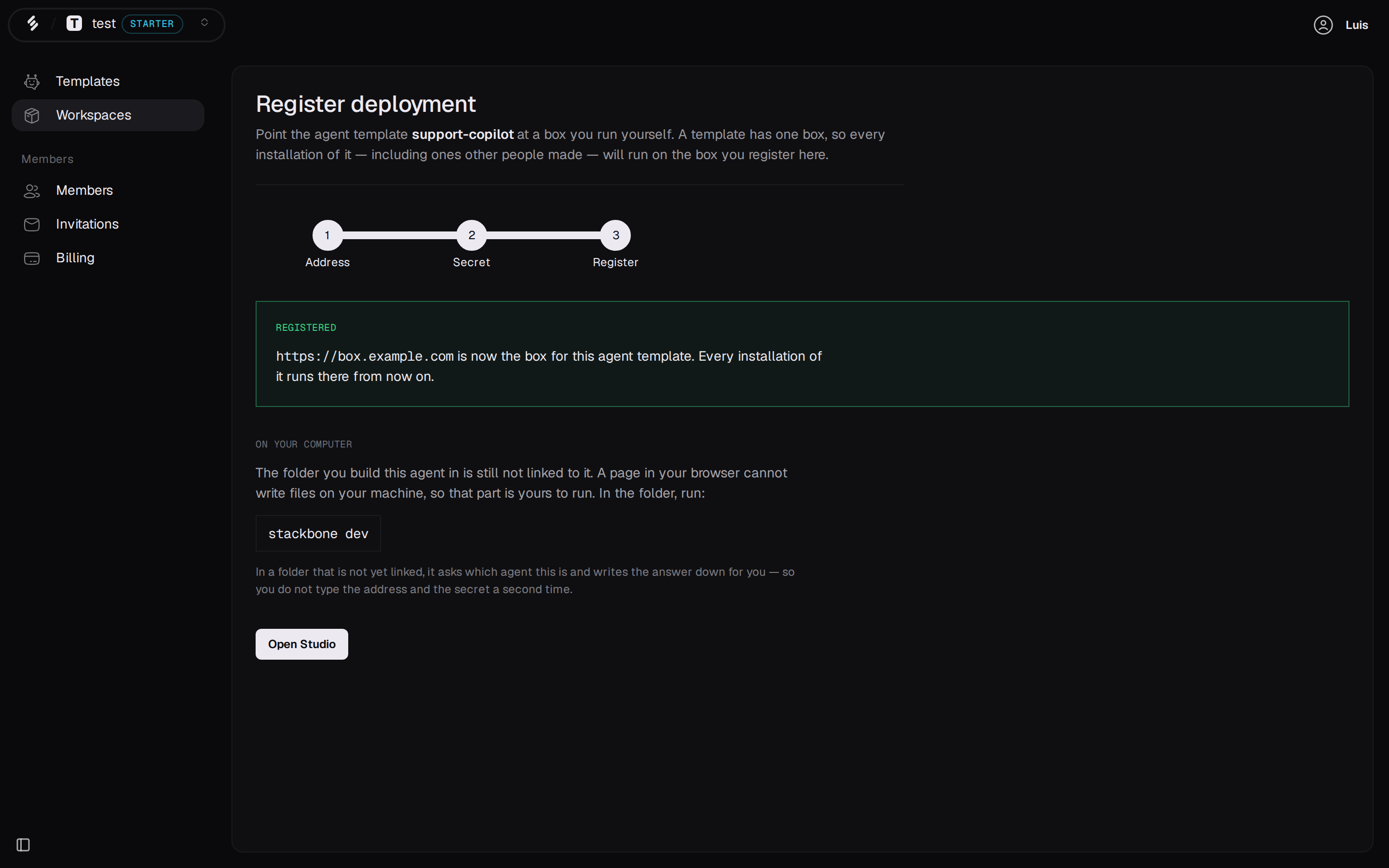 The success panel, naming the registered address and the stackbone dev command.